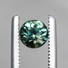 1.13CT BRILLIANT ROUND MADAGASCAR SAPPHIRE, COLOR SHIFTING WARM GREY TO BRIGHT GREEN TEAL, 5.72X74.42MM