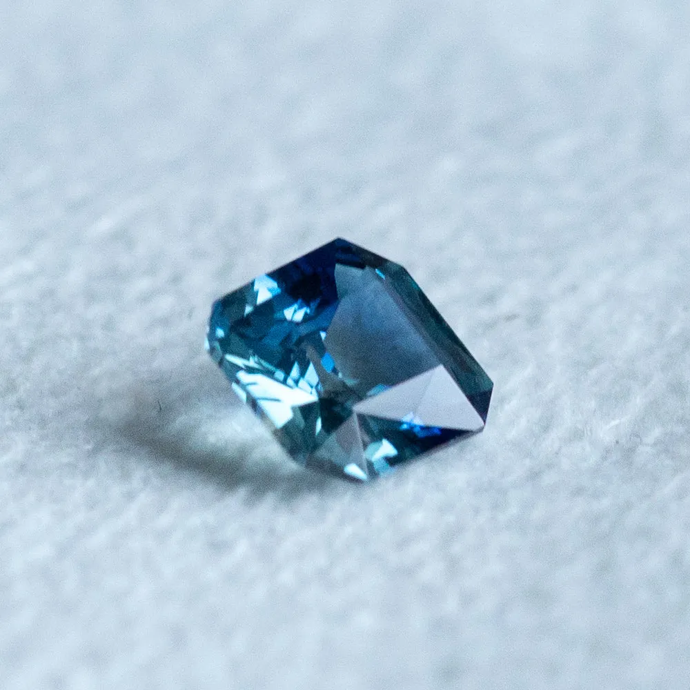 1.25CT RADIANT CUT MADAGASCAR TEAL BLUE PARTI SAPPHIRE, 6.68X6.04X3.48MM