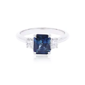 14K WHITE GOLD HENNE-FIT THREE STONE RING WITH A RADIANT-CUT SAPPHIRE AND HALF-MOON SIDE DIAMONDS